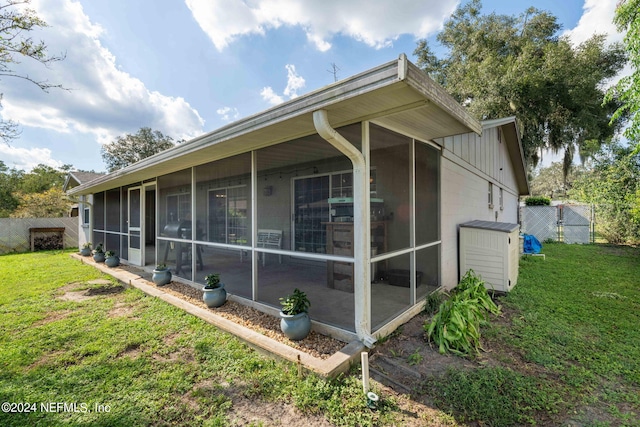 7876 Spanish Oaks Dr, Jacksonville, FL 32221 - view of home's exterior with a sunroom