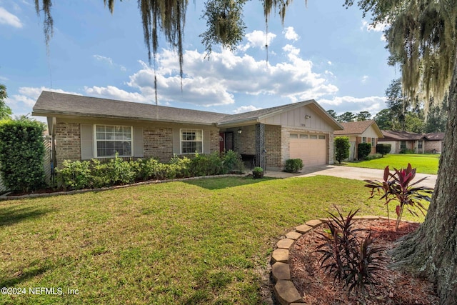7876 Spanish Oaks Dr, Jacksonville, FL 32221 - ranch-style house with brick siding, a garage, concrete driveway, and a front yard