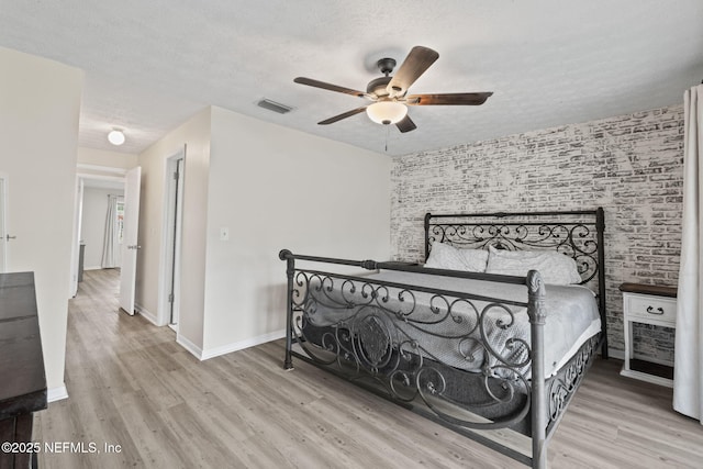7876 Spanish Oaks Dr, Jacksonville, FL 32221 - bedroom featuring wood finished floors, a textured ceiling, baseboards, and ceiling fan