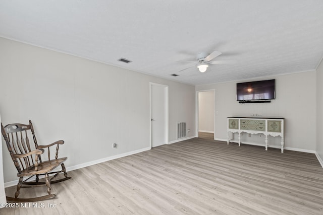 7876 Spanish Oaks Dr, Jacksonville, FL 32221 - living area with wood finished floors, ceiling fan, and baseboards