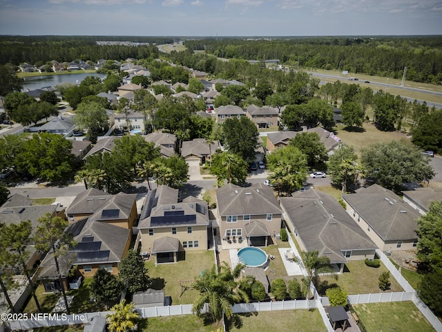 aerial view with a water view, a residential view, and a view of trees