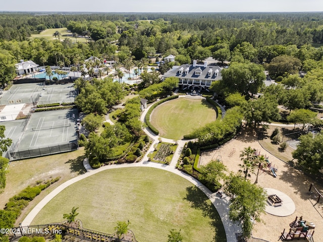 birds eye view of property featuring a forest view