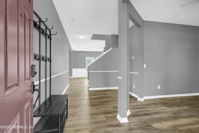 entryway featuring ceiling fan, baseboards, and wood finished floors