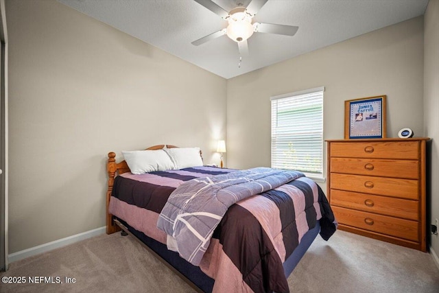 bedroom featuring baseboards, a ceiling fan, and carpet flooring
