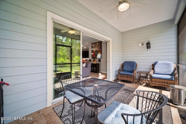 view of patio / terrace featuring outdoor dining area and ceiling fan