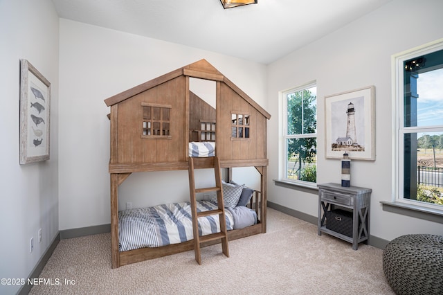 367 Maralinda Dr, Saint Augustine, FL 32095 - carpeted bedroom with baseboards and multiple windows