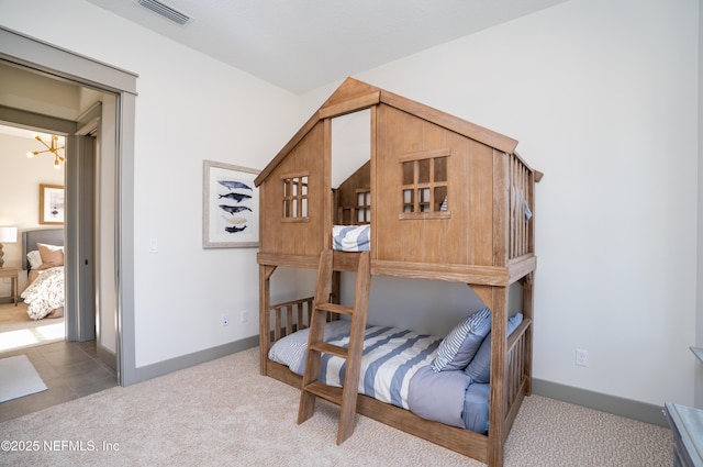 367 Maralinda Dr, Saint Augustine, FL 32095 - carpeted bedroom featuring visible vents, baseboards, and an inviting chandelier