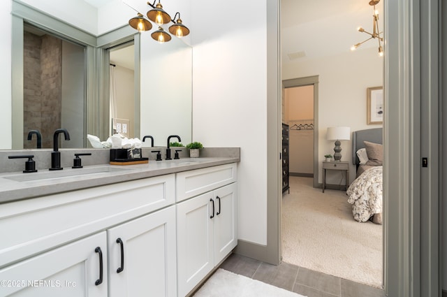 367 Maralinda Dr, Saint Augustine, FL 32095 - full bathroom with vanity, a notable chandelier, and baseboards