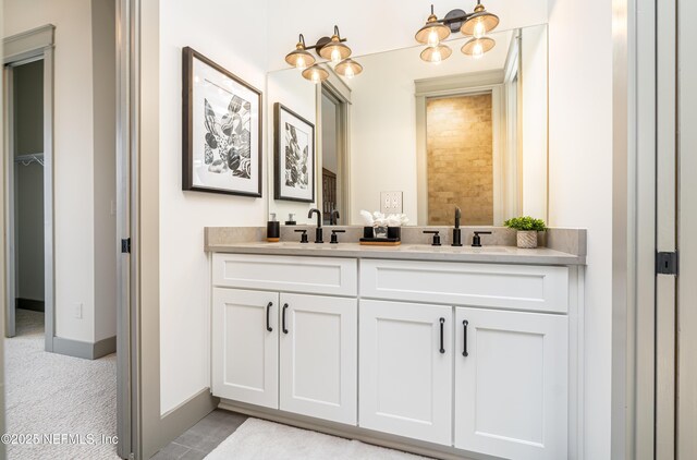 367 Maralinda Dr, Saint Augustine, FL 32095 - bathroom with double vanity, a sink, and baseboards