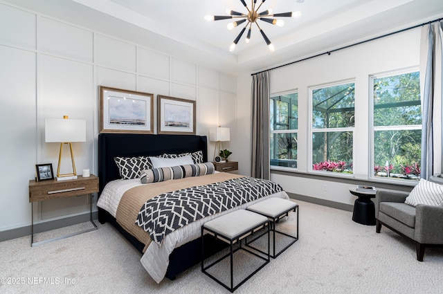 367 Maralinda Dr, Saint Augustine, FL 32095 - carpeted bedroom with a tray ceiling, baseboards, and a notable chandelier