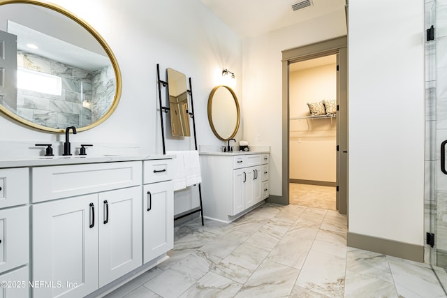 367 Maralinda Dr, Saint Augustine, FL 32095 - bathroom with two vanities, a shower stall, visible vents, marble finish floor, and a sink
