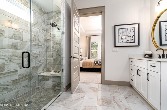 367 Maralinda Dr, Saint Augustine, FL 32095 - ensuite bathroom featuring marble finish floor, baseboards, vanity, and ensuite bath