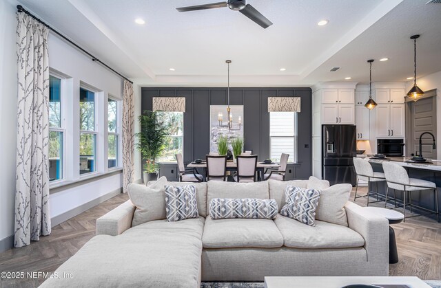 367 Maralinda Dr, Saint Augustine, FL 32095 - living area featuring a tray ceiling, recessed lighting, and a healthy amount of sunlight