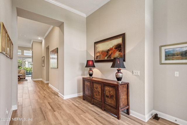 95566 Amelia National Pkwy, Fernandina Beach, FL 32034 - hallway with ornamental molding and light wood-style floors