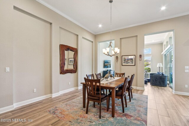 95566 Amelia National Pkwy, Fernandina Beach, FL 32034 - dining room with a chandelier, light wood finished floors, crown molding, and recessed lighting