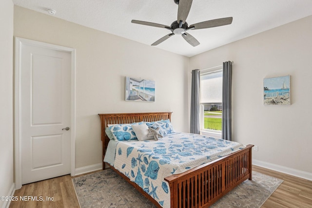 95566 Amelia National Pkwy, Fernandina Beach, FL 32034 - bedroom with wood finished floors and ceiling fan