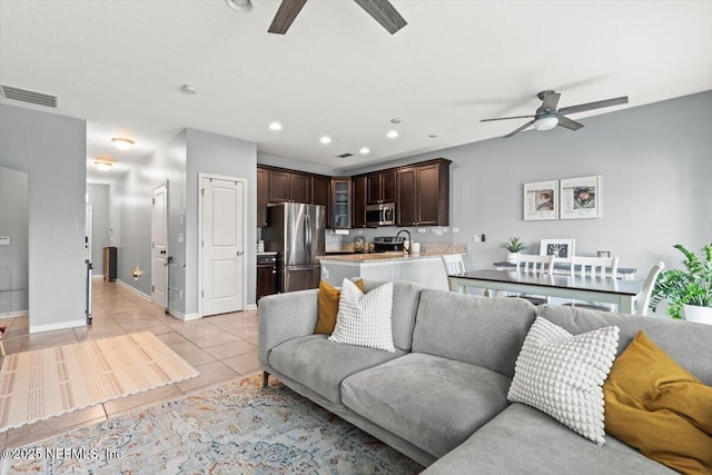 1580 Landau Rd, Jacksonville, FL 32225 - living room with a ceiling fan, light tile patterned floors, baseboards, and recessed lighting