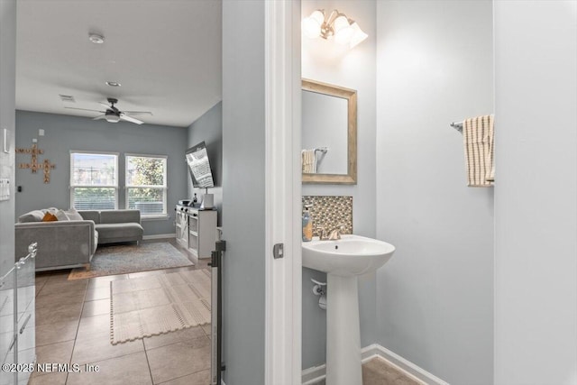1580 Landau Rd, Jacksonville, FL 32225 - bathroom with a ceiling fan, baseboards, tile patterned flooring, and a sink