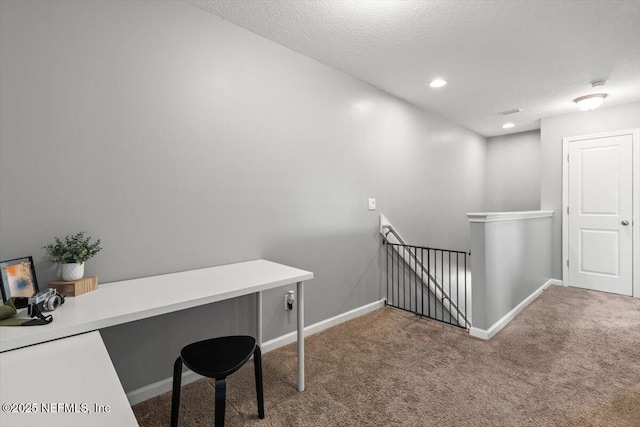 1580 Landau Rd, Jacksonville, FL 32225 - hall with an upstairs landing, carpet flooring, baseboards, a textured ceiling, and recessed lighting