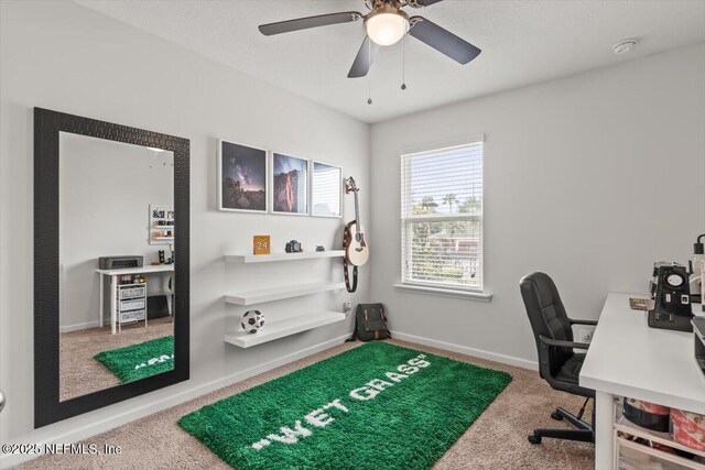1580 Landau Rd, Jacksonville, FL 32225 - carpeted home office with a ceiling fan and baseboards