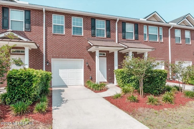 1580 Landau Rd, Jacksonville, FL 32225 - multi unit property with driveway, a garage, and brick siding