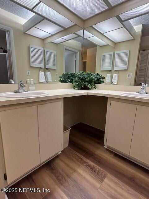 9360 Craven Rd # 607, Jacksonville, FL 32257 - bathroom featuring wood finished floors and vanity