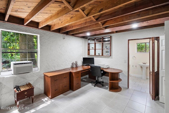 home office featuring a textured wall, a sink, beam ceiling, cooling unit, and light tile patterned floors