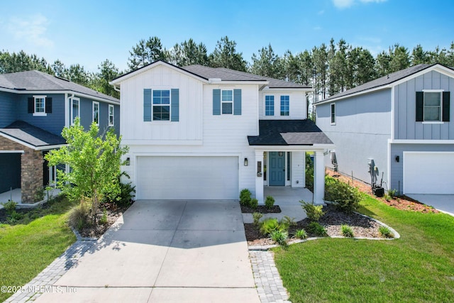 597 Meadow Ridge Dr, Saint Augustine, FL 32092 - view of front facade featuring board and batten siding, driveway, a front yard, an attached garage, and a shingled roof
