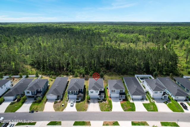 597 Meadow Ridge Dr, Saint Augustine, FL 32092 - drone / aerial view featuring a residential view and a wooded view