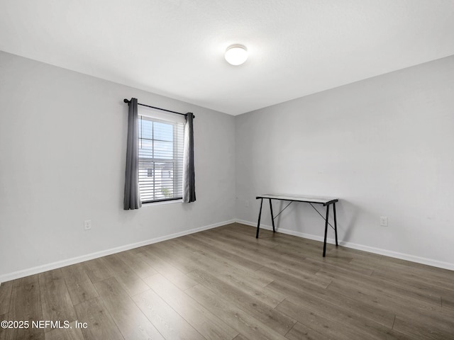 597 Meadow Ridge Dr, Saint Augustine, FL 32092 - empty room with baseboards and wood finished floors
