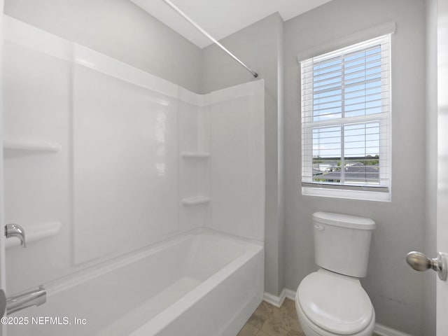 597 Meadow Ridge Dr, Saint Augustine, FL 32092 - bathroom with baseboards, shower / bath combination, and toilet