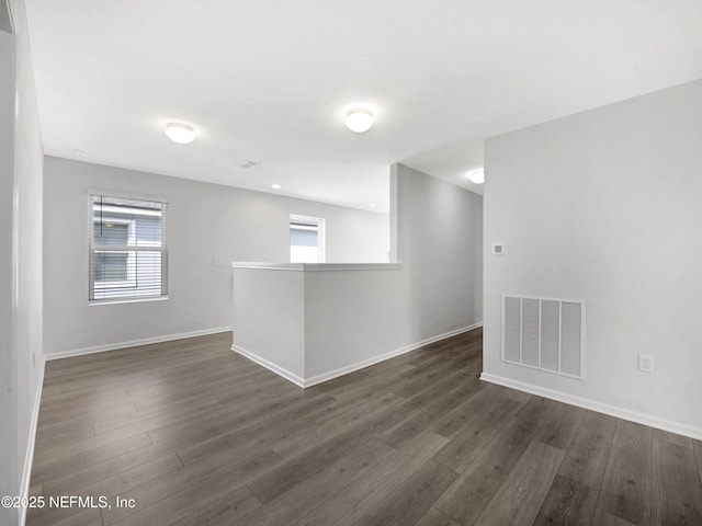597 Meadow Ridge Dr, Saint Augustine, FL 32092 - unfurnished room with baseboards, visible vents, and dark wood finished floors