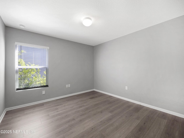 597 Meadow Ridge Dr, Saint Augustine, FL 32092 - empty room with baseboards and wood finished floors