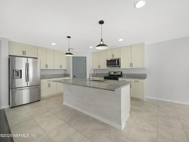 597 Meadow Ridge Dr, Saint Augustine, FL 32092 - kitchen featuring appliances with stainless steel finishes, a sink, light tile patterned floors, light stone counters, and recessed lighting