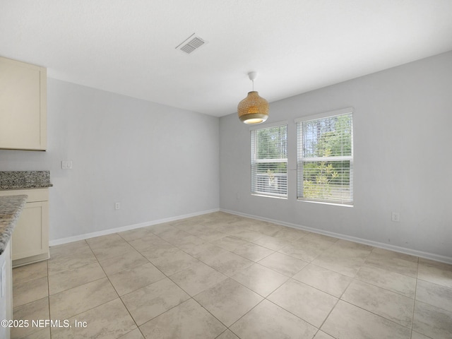 597 Meadow Ridge Dr, Saint Augustine, FL 32092 - unfurnished dining area featuring baseboards, light tile patterned floors, and visible vents
