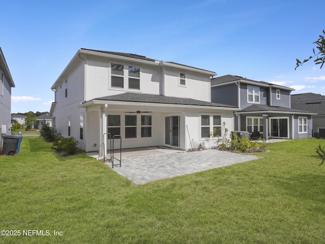 597 Meadow Ridge Dr, Saint Augustine, FL 32092 - rear view of property with a lawn, a patio, stucco siding, and central air condition unit