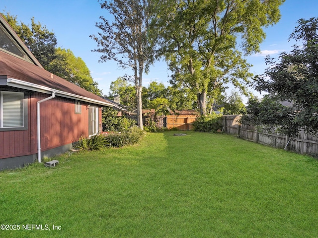 view of yard with a fenced backyard