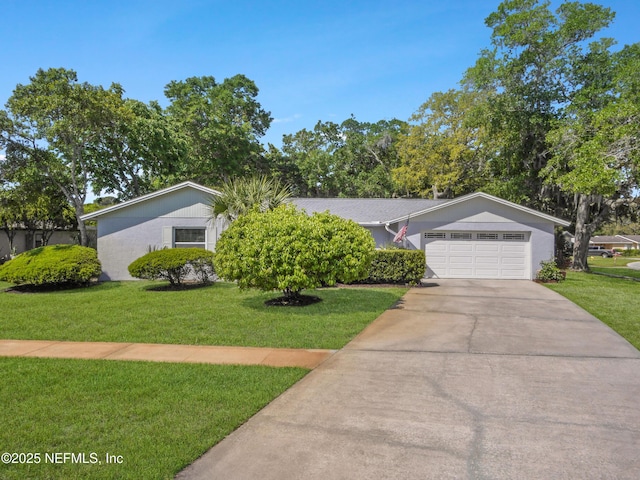 single story home featuring concrete driveway, a front lawn, and an attached garage