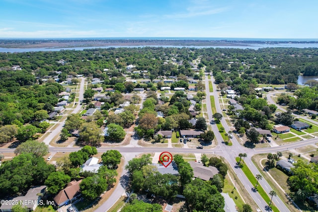 birds eye view of property with a residential view and a water view