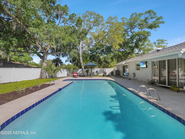 view of pool featuring a fenced backyard, a patio, and a fenced in pool