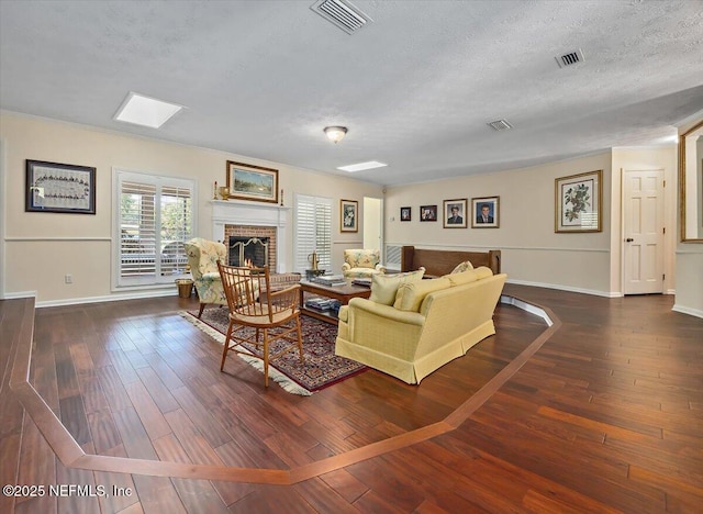 7812 Hunters Grove Rd, Jacksonville, FL 32256 - living room featuring baseboards, visible vents, hardwood / wood-style flooring, and a textured ceiling