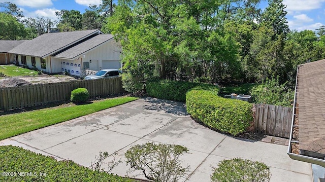 7812 Hunters Grove Rd, Jacksonville, FL 32256 - view of patio with a garage and fence private yard