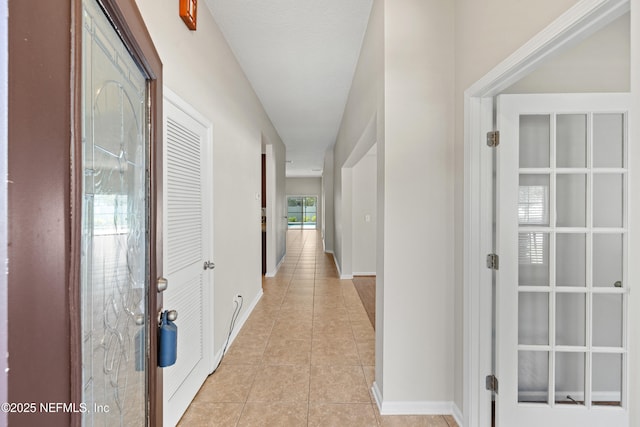 80 St Croix Island Dr, Saint Augustine, FL 32092 - corridor featuring light tile patterned flooring and french doors