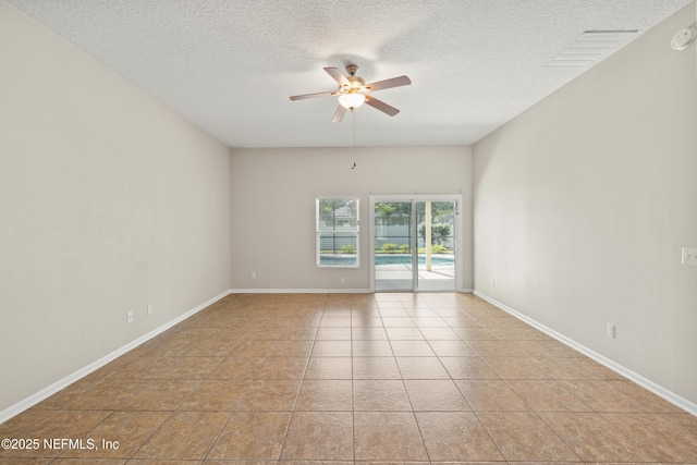80 St Croix Island Dr, Saint Augustine, FL 32092 - empty room with ceiling fan, a textured ceiling, and tile patterned flooring
