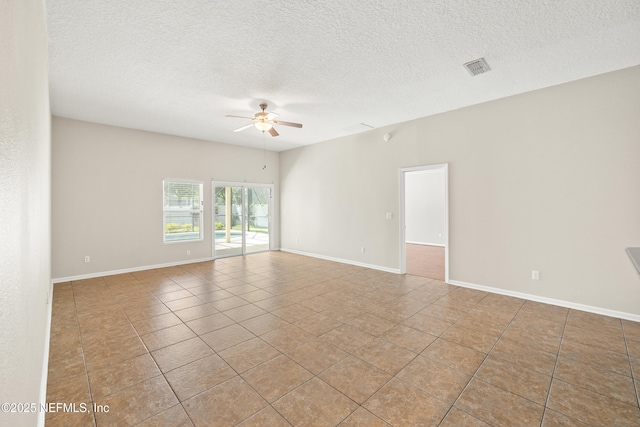 80 St Croix Island Dr, Saint Augustine, FL 32092 - tiled spare room featuring ceiling fan and a textured ceiling