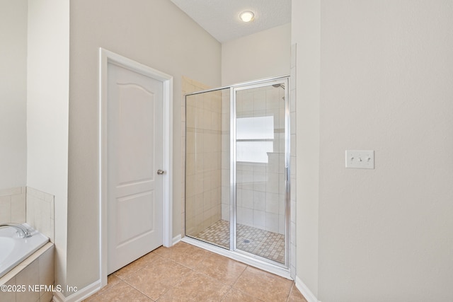 80 St Croix Island Dr, Saint Augustine, FL 32092 - full bathroom featuring a stall shower, a garden tub, and tile patterned flooring