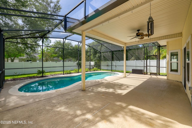80 St Croix Island Dr, Saint Augustine, FL 32092 - view of swimming pool featuring a patio, a fenced backyard, a ceiling fan, and glass enclosure