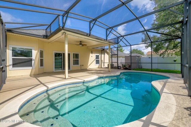 80 St Croix Island Dr, Saint Augustine, FL 32092 - view of swimming pool featuring a patio, a ceiling fan, and glass enclosure