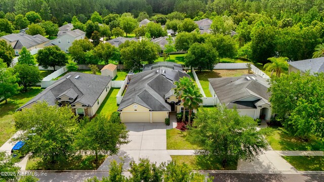 80 St Croix Island Dr, Saint Augustine, FL 32092 - aerial perspective of suburban area featuring a heavily wooded area