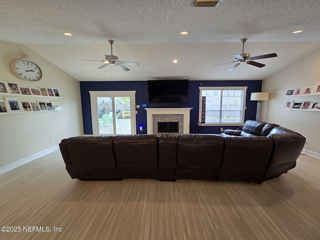 10 Quail Ln, Jacksonville Beach, FL 32250 - living area with a ceiling fan, lofted ceiling, and a textured ceiling